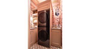 stacked laundry pair in small pink room