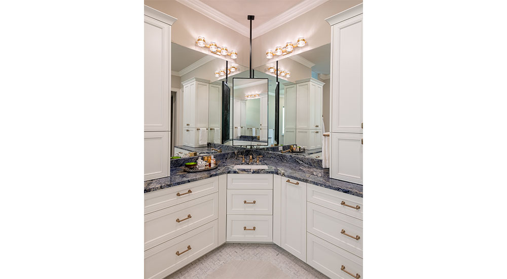hanging corner mirror in traditional primary bathroom multigenerational design