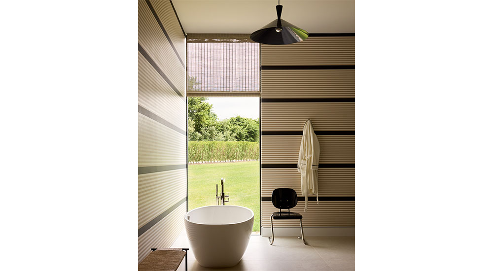 serene bathroom with window and soaking tub
