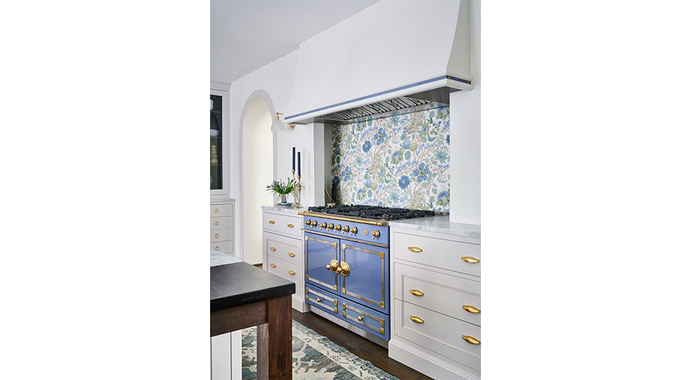 Jerel lake appliance package blue range with a colorful backsplash