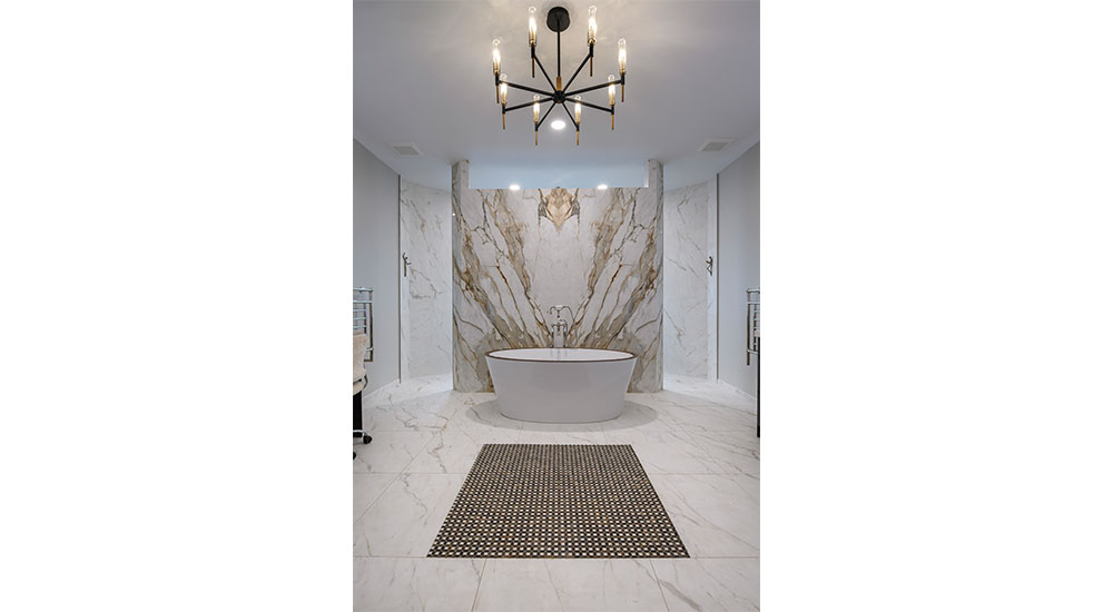 freestanding bath tub in luxury bath with chandelier