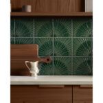 dark green textured tile as backsplash with brown wood cabinets