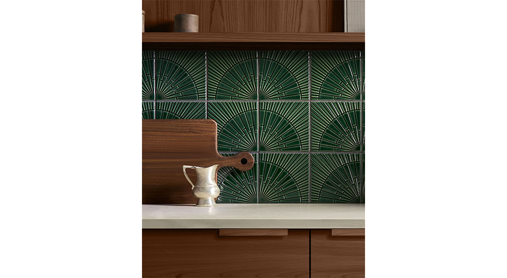 dark green textured tile as backsplash with brown wood cabinets