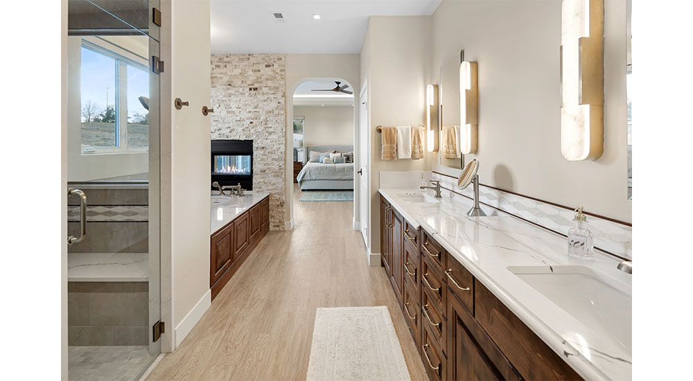 living in place primary bath with tub and shower and vanity