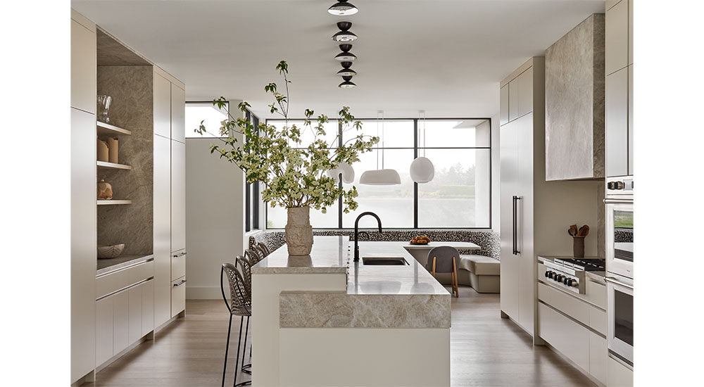 modern beach kitchen with island banquette and large window