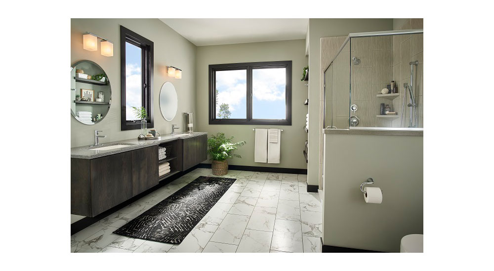 primary bath with floating vanity and window