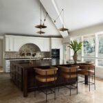 castle kitchen island and beam on peaked ceiling