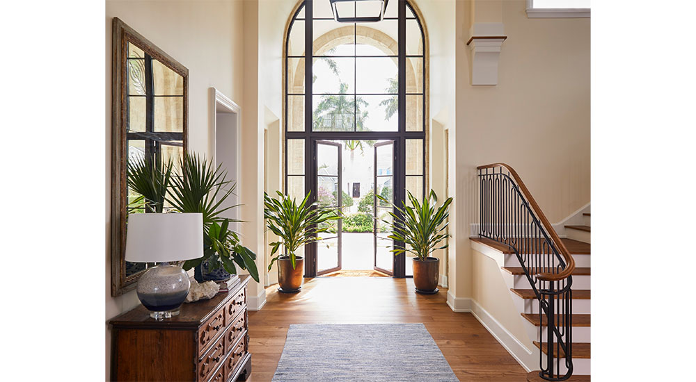 entry hallway with double height windows
