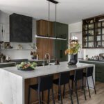 modern kitchen with dark cabinets and waterfall island