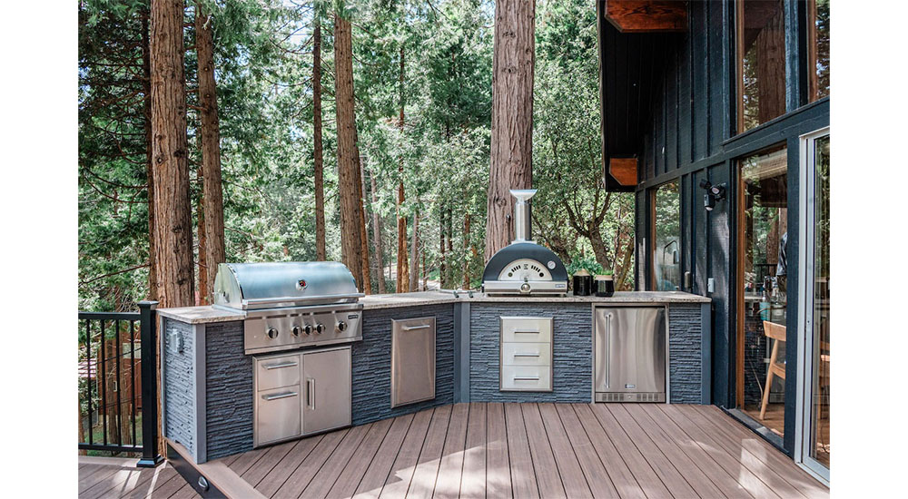outdoor kitchen with grill, pizza oven and refrigerator
