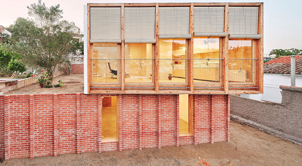 APE Grupo Architecture Awards House on a Brick Plinth by Ágora Arquitectura