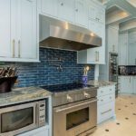 range microwave and wine refrigerator in historic blue kitchen