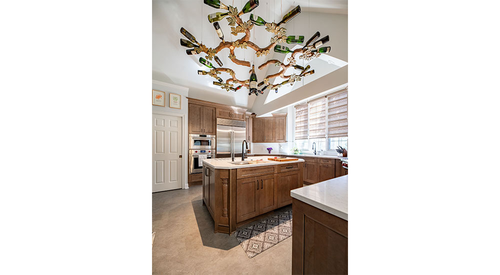 wine bottle chandelier over kitchen island