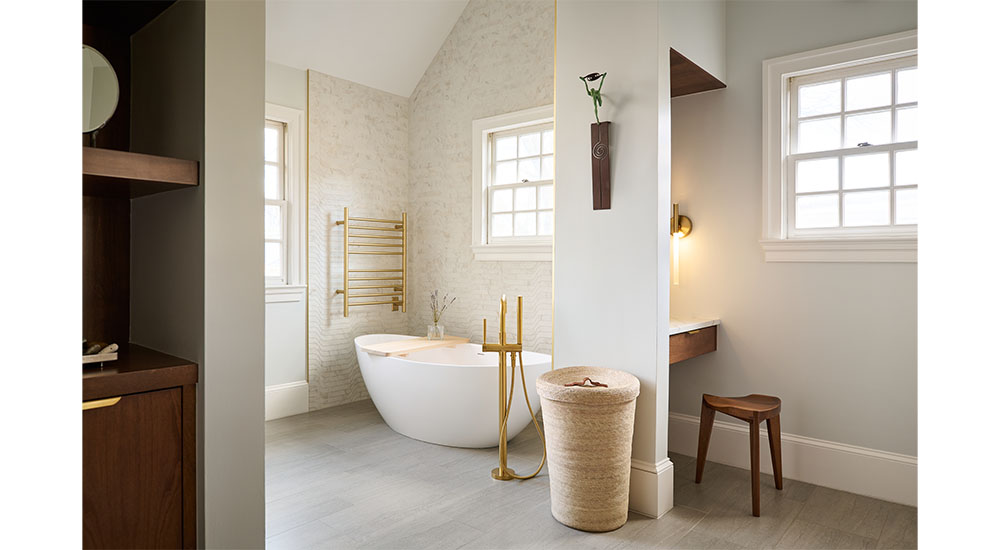 bathroom with freestanding tub and vanity niche
