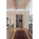 view from kitchen into walk-in pantry