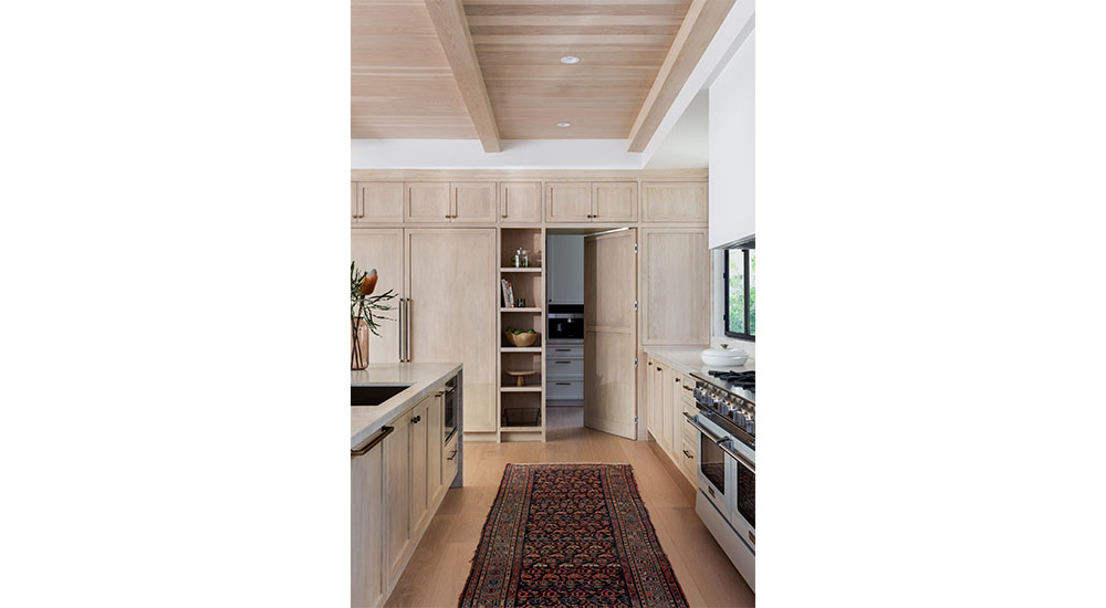 view from kitchen into walk-in pantry