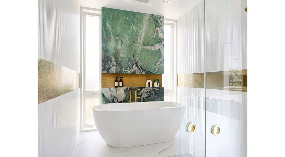 kbb awards best bath freestanding tub with green stone feature wall