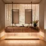 kips bay bathroom with double vanity in fluted glass and stone