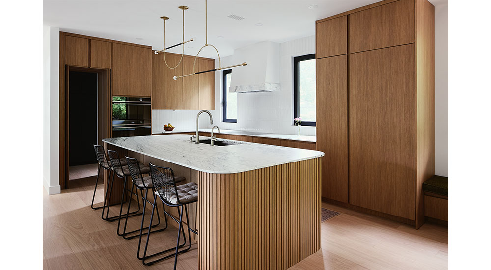 modern kitchen remodel with island wrapped in fluted wood